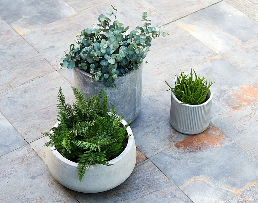 Three garden planters on a patio 