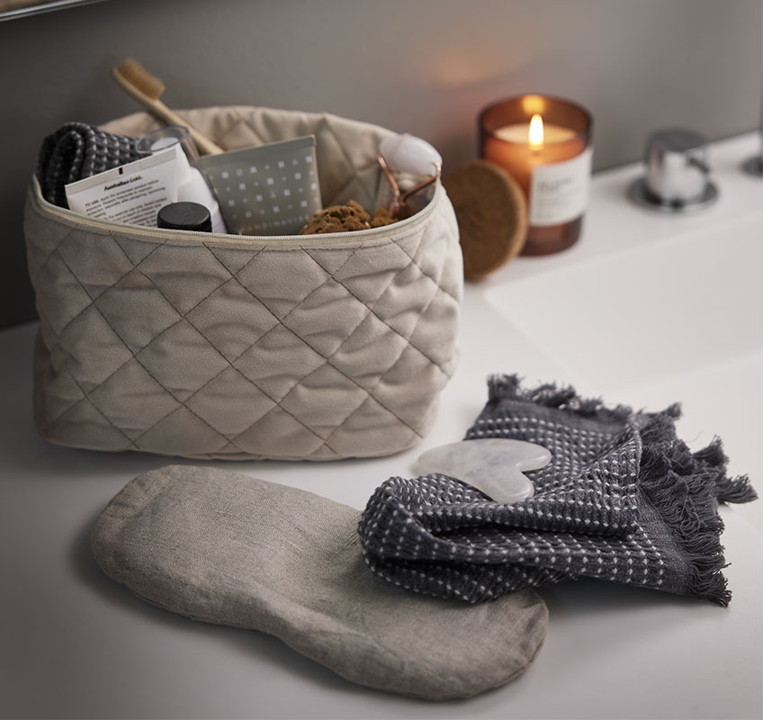 RUTVIK eye mask, VALLSTA massage stone and KNIVSTA wash bag Eye mask, wash cloth and rose massage stone on bathroom sink
